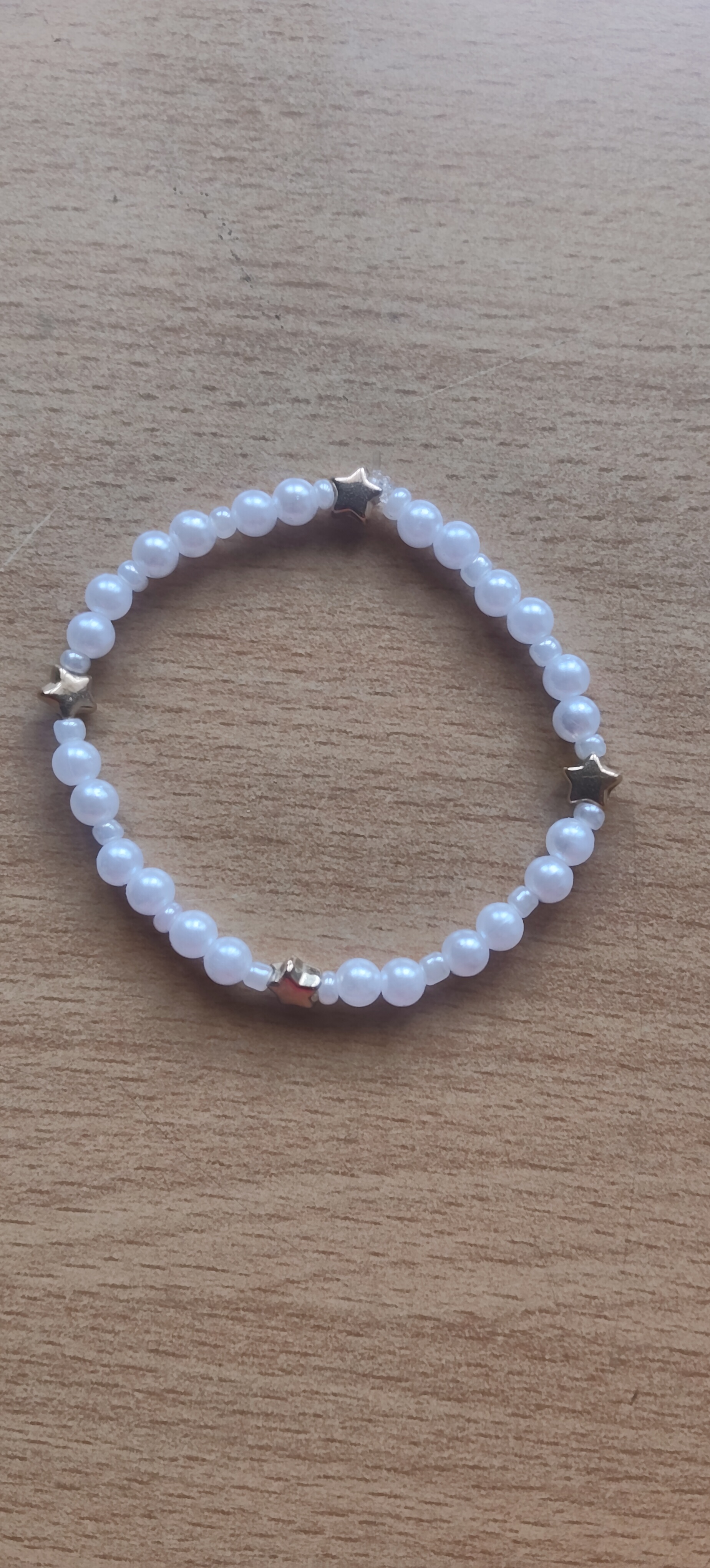 Pearl white bead with golden star spacers